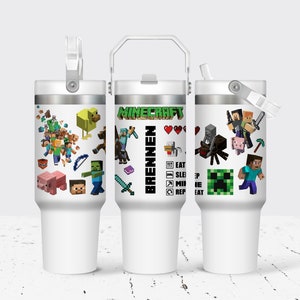 May include: Three white stainless steel tumblers with a Minecraft theme. The tumblers feature different Minecraft characters and designs, including a creeper, a spider, a pig, and a zombie. One tumbler has the text "Minecraft" and "Brennen" on it. Another tumbler has a list of instructions: "Eat, Sleep, Mine, Repeat."