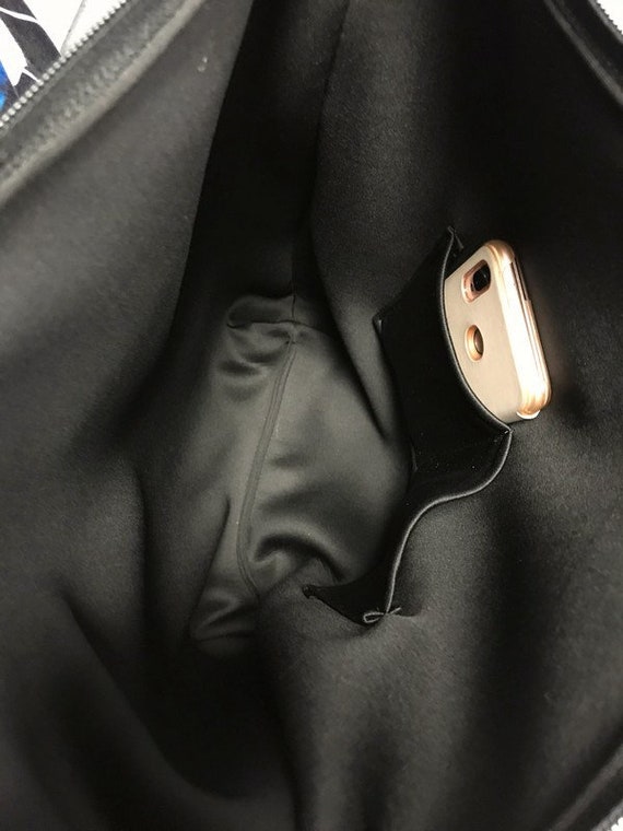 Black backpack online with silver zippers