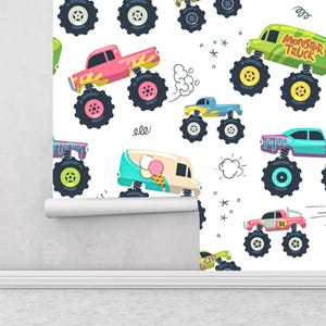 May include: Wallpaper with a repeating pattern of cartoon monster trucks and an ice cream van on a white backdrop. The vehicles are in pink, green, blue, and teal, with large black wheels. Some trucks have the text "Monster Truck".