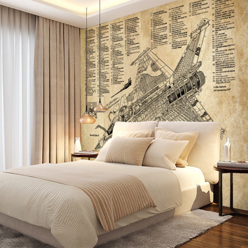 May include: A beige bedroom with a bed and two hanging lights. The wall behind the bed has a vintage style illustration of a plane with numbered parts and text. The bed has a beige headboard and a beige and brown striped blanket.