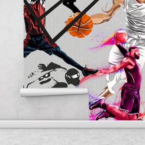 A gym interior with a wall mural featuring a basketball theme. The mural is a collage of basketball players in various poses, basketballs, and basketball hoops. The gym also has a weight bench, dumbbells, a kettlebell, and a blue exercise ball.