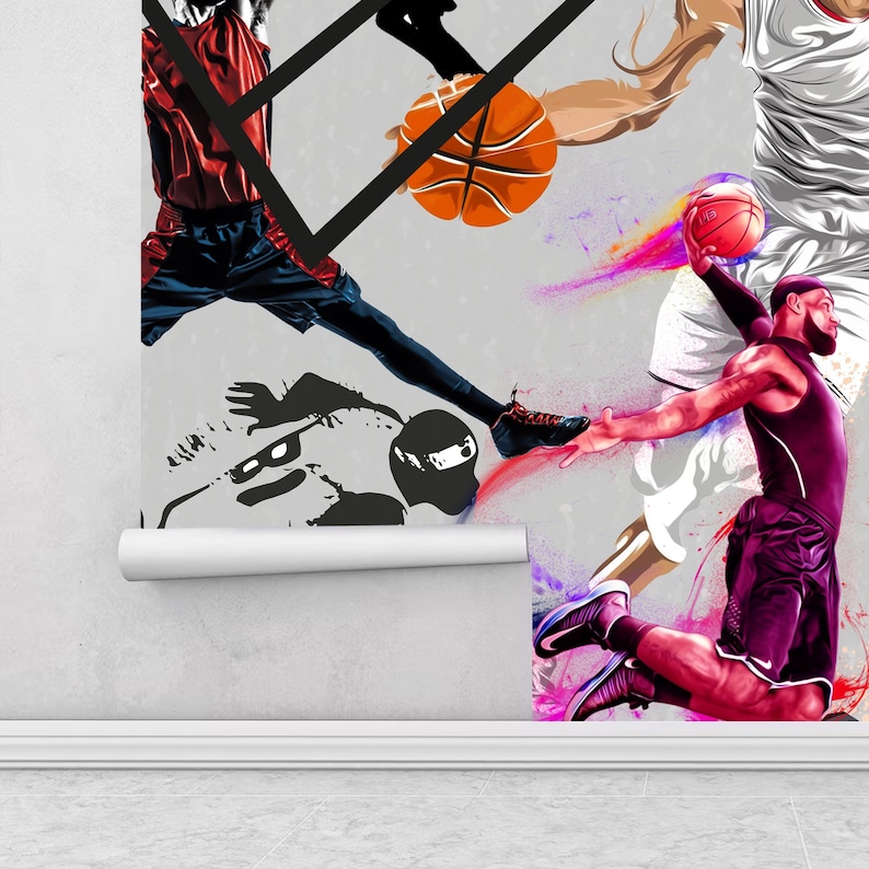 A gym interior with a wall mural featuring a basketball theme. The mural is a collage of basketball players in various poses, basketballs, and basketball hoops. The gym also has a weight bench, dumbbells, a kettlebell, and a blue exercise ball.