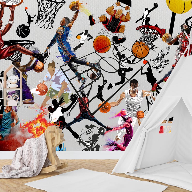 A gym interior with a wall mural featuring a basketball theme. The mural is a collage of basketball players in various poses, basketballs, and basketball hoops. The gym also has a weight bench, dumbbells, a kettlebell, and a blue exercise ball.