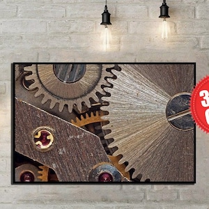 Op de afbeelding: Een close-up van een metalen tandwielsysteem met ingewikkelde details. De tandwielen zijn gemaakt van zilver en goudkleurig metaal en hebben een versleten, industriële uitstraling. De afbeelding is een geweldig voorbeeld van de schoonheid van de werktuigbouwkunde.