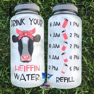 Motivational Water Bottle, Drink Your Heiffin Water, With a Cute Cow Wearing a Pink Bandana printed on a 34oz water bottle.