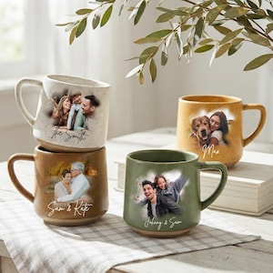 May include: Four ceramic mugs with speckled finishes in cream, tan, and green. Each mug features a custom photo print of people or a dog, with names or phrases like The Smith, Sam & Kate, Johnny & Sam, and Max printed in a cursive script below the images.