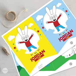 Pu&ograve; includere: Un set di due bandiere di compleanno colorate con un personaggio di coniglio dei cartoni animati con il nome "JORDAN" e l'et&agrave; "3 ANOS" su ogni bandiera. Le bandiere sono gialle e blu con accenti rossi, bianchi e blu.