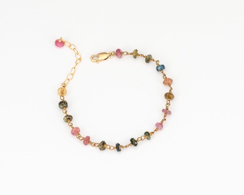 The bracelet has a lobster claw clasp, & 1.5 inch extension chain.