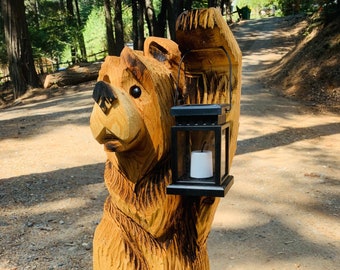 3ft tall Cedar bear chainsaw carving with solar lantern made and sold from USA