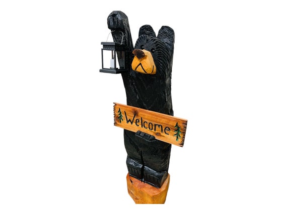 4ft black bear chainsaw carving with solar lantern and personalized sign
