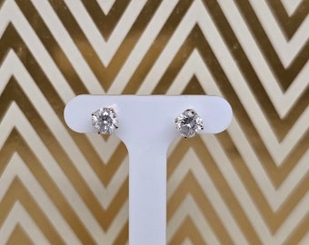 Circa 1980, a pair of 14k yellow gold and round diamond ear-stud earrings, 1ctw.