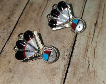 Circa 2000, handmade “Zuni Sun” sterling silver Turquoise, coral, black onyx, and Mother of Pearl earrings studs.