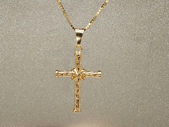 Circa 1980, a 18k yellow gold cross pendant. - image 7