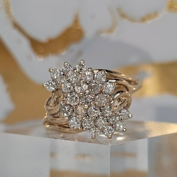 Circa 1980, a 14k yellow gold and diamond cluster ring, size 7.