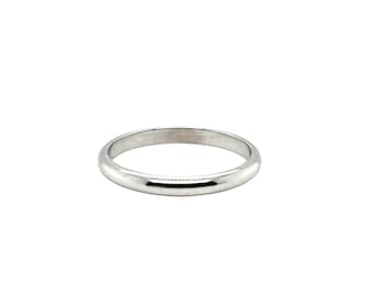 May include: A simple, silver wedding band with a smooth, polished finish.