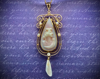 Circa 1960, a 10k yellow gold coral cameo lavalier pendant with pearls.