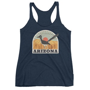 May include: A navy blue tank top with a vintage-style graphic of a roadrunner in a desert landscape with the text "ARIZONA".