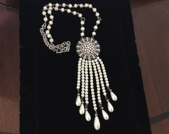 Long white pearls necklace with strass brooch and 7 long pearl tassels.