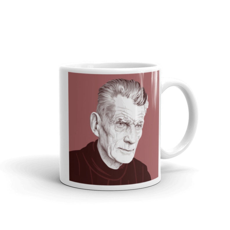 May include: White ceramic mug with a red background and a black and white illustration of a man with grey hair. The man is wearing a dark turtleneck sweater.