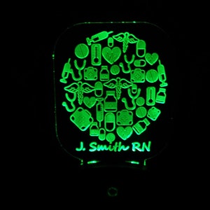 May include: Green night light with a circle of medical icons and the text "J. Smith RN" at the bottom.