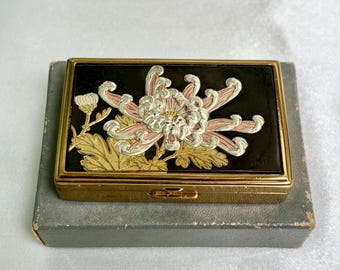 Vintage Clover musical compact.  Chrysanthemum design, in original box. 1950s