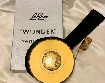 Vintage Le Rage Wonder Vanity Case. All in one gilt powder compact, lipstick, blusher, perfume flask and brush. 1950s