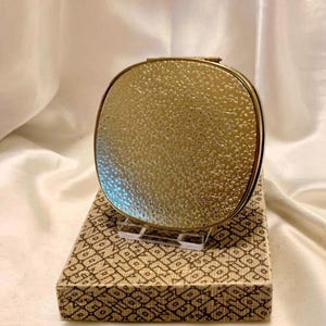 Vintage Mascot silver compact. Repousse embossed silver plate Unused in box. Made in England. 1960s