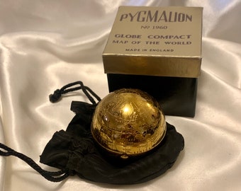 Pygmalion World globe compact. immaculate condition with puff, sifter and Dorothy bag, boxed. Vintage compact