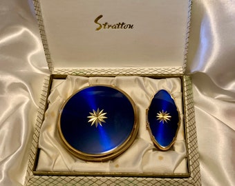 Gorgeous vintage Stratton compact set. Translucent blue star convertible compact and lipstick mirror.  Unused and original box.