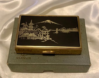 Vintage Japanese damascene musical compact. Stunning clover powder compact. Original presentation box. Mint. Made in the 1950s