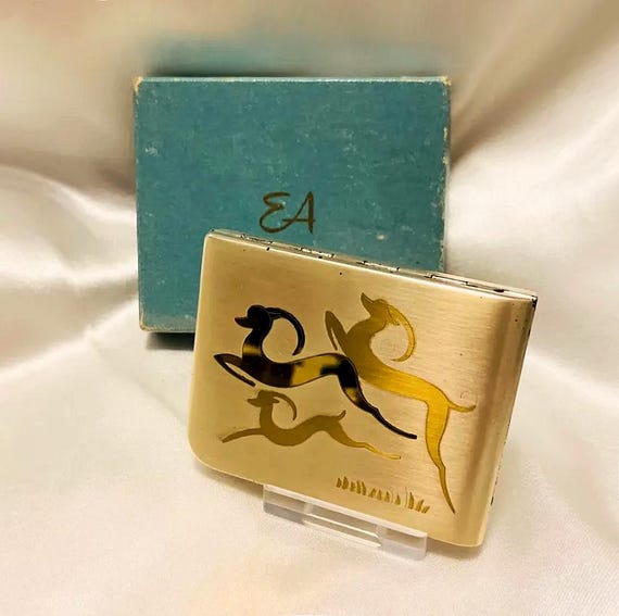 Vintage Elgin American compact.  Deer design. Brushed silver and gold plated . Unused in box. For loose powder. Made in USA. 1940s
