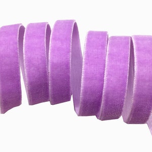 May include: A roll of lavender velvet ribbon. The ribbon is soft and has a subtle sheen.