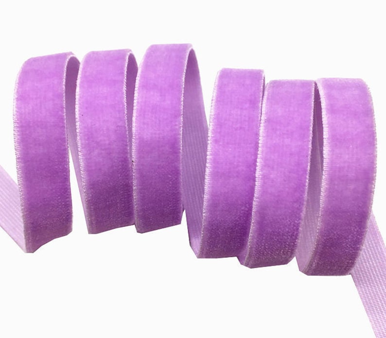 May include: A roll of lavender velvet ribbon. The ribbon is soft and has a subtle sheen.