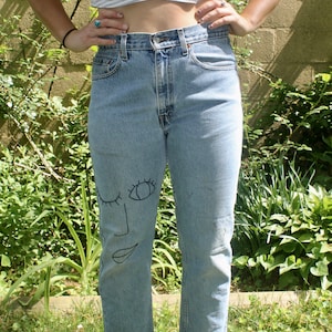 Embroidered Face Jeans