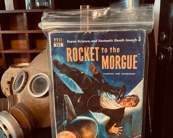 Raro ejemplar antiguo de ciencia ficción titulado "Cohete a la morgue".