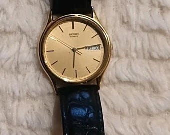 VINTAGE SEIKO Watch Men's Gold Tone Spanish English Day Date Black leather band