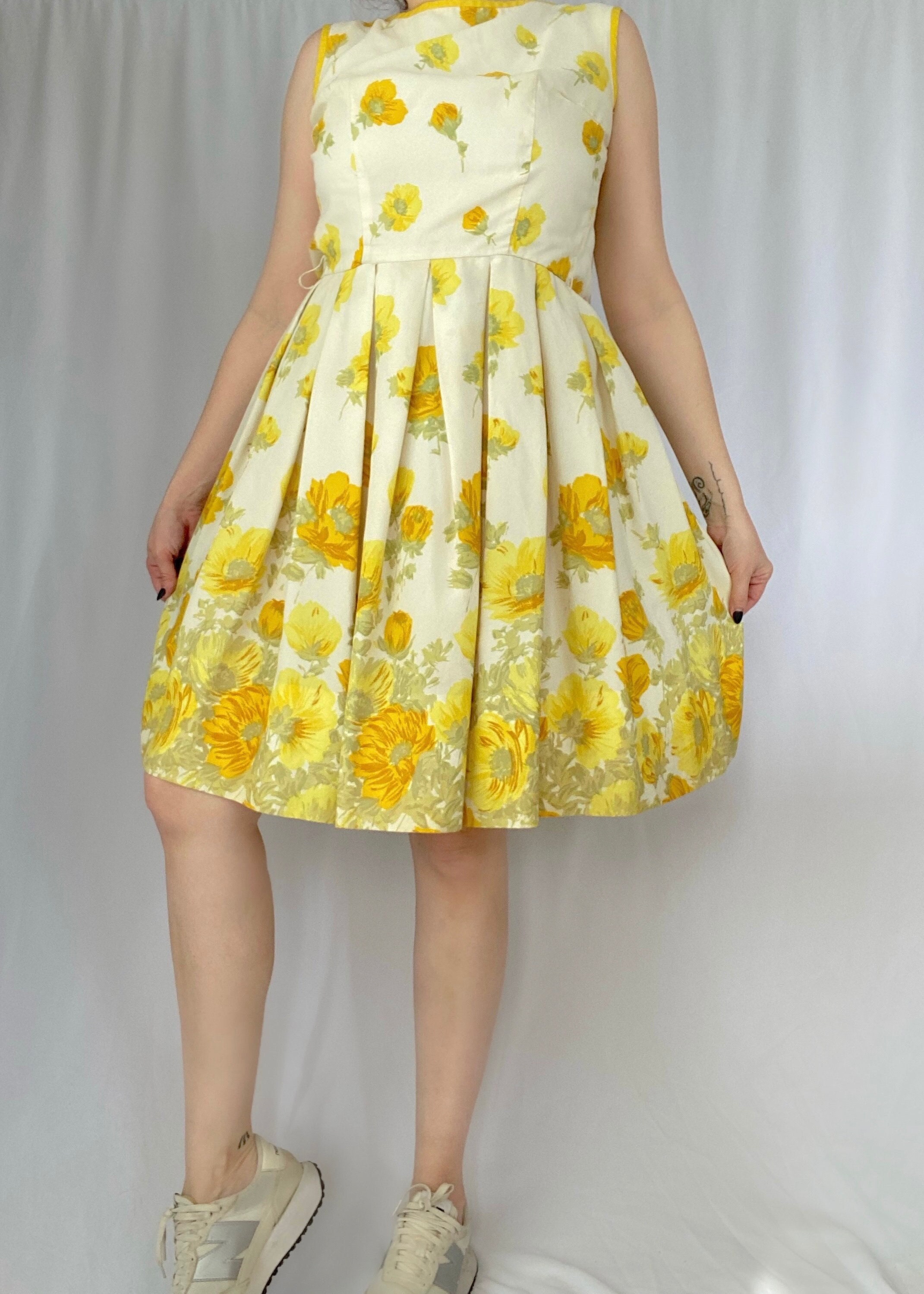 vintage floral yellow dress 'Imani' Buttercup Print Pleated Cotton Mini this printed dress makes a great addition to your wardrobe Vintage 60's Yellow Floral Sleeveless