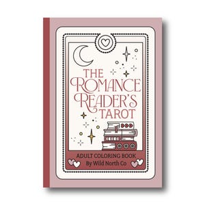 May include: A pink and white coloring book with a tarot card design. The cover features a crescent moon, stars, and a stack of books. The title is "The Romance Reader's Tarot" and the text below reads "Adult Coloring Book by Wild North Co."