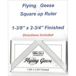 May include: White plastic ruler for making flying geese quilt blocks. The ruler is 1-3/8 inches by 2-3/4 inches and includes directions. The ruler is labeled "Flying Geese" and "Bloc Loc".