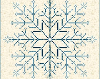 May include: A blue and white snowflake design on a beige background. The snowflake is made up of a series of interlocking squares and triangles.