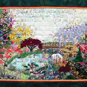 May include: A colorful quilt depicting a garden scene with a bridge, flowers, and trees. The quilt is made of fabric scraps and is a beautiful example of patchwork quilting.