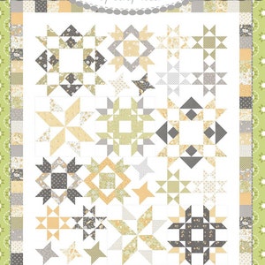 May include: A quilt pattern called "Joy Filled" from the Coriander Quilts collection by Corey Yoder. The pattern features a variety of star and square blocks in shades of gray, yellow, and green.