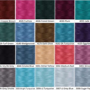 May include: A grid of colorful thread spools, each labeled with a number and color name. Colors range from copper brown and fuchsia to forest green, plum, and jade. Additional colors include turf green, wedgewood, dark olive, and dark turquoise.