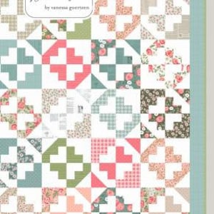 May include: A quilt pattern called "June Bug" from the "Jella Boutique" pattern collection by Vanessa Goertzen. The pattern features a patchwork design with a variety of floral and geometric shapes in shades of pink, green, blue, and white.