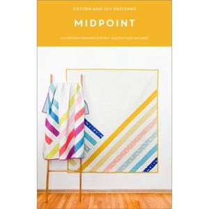 May include: A colorful quilt pattern called "Midpoint" by Cotton and Joy Patterns. The quilt features a diagonal design with stripes of various colors, including yellow, pink, blue, and green. The pattern is a confident beginner pattern with multiple sizes included.