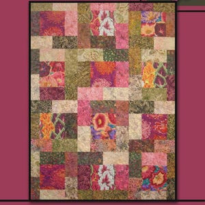 May include: A patchwork quilt with the word "INTRIGUE" at the top. The quilt features squares of floral fabric in shades of pink, orange, green, and purple. A pink rose is in the upper right corner. The words "Villa Rosa Designs" are at the bottom.