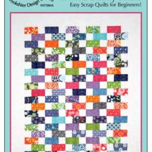 May include: A colorful quilt pattern called "Baby Bricks & Mod Daddy Bricks" by Brookshier Design Studio. The pattern features a patchwork of colorful squares and rectangles, with a white background. The text "Easy Scrap Quilts for Beginners!" is printed below the title.
