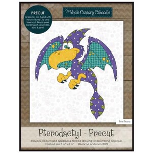 May include: A precut applique pattern for a purple and green pterodactyl. The pattern includes a finished drawing for assembling the applique. The finished size is 7 inches by 8 1/2 inches. The Whole Country Caboodle. Leanne Anderson 2022.