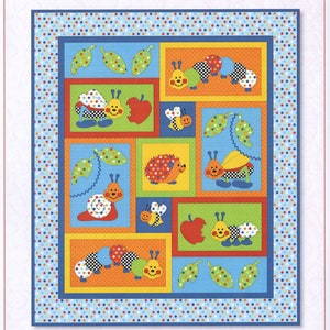 May include: A colorful quilt pattern featuring a variety of bugs, including caterpillars, snails, ladybugs, and bees. The pattern is set against a blue background with white polka dots. The title "Bugs-a-lot" is at the top of the pattern, and the text "Kids Quilts...loveable heirlooms" is at the bottom.