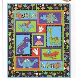 May include: A colorful quilt with a dinosaur theme. The quilt features various dinosaurs in different colors, set against a patchwork background with the text "Dino Daze" and "Kids Quilts".